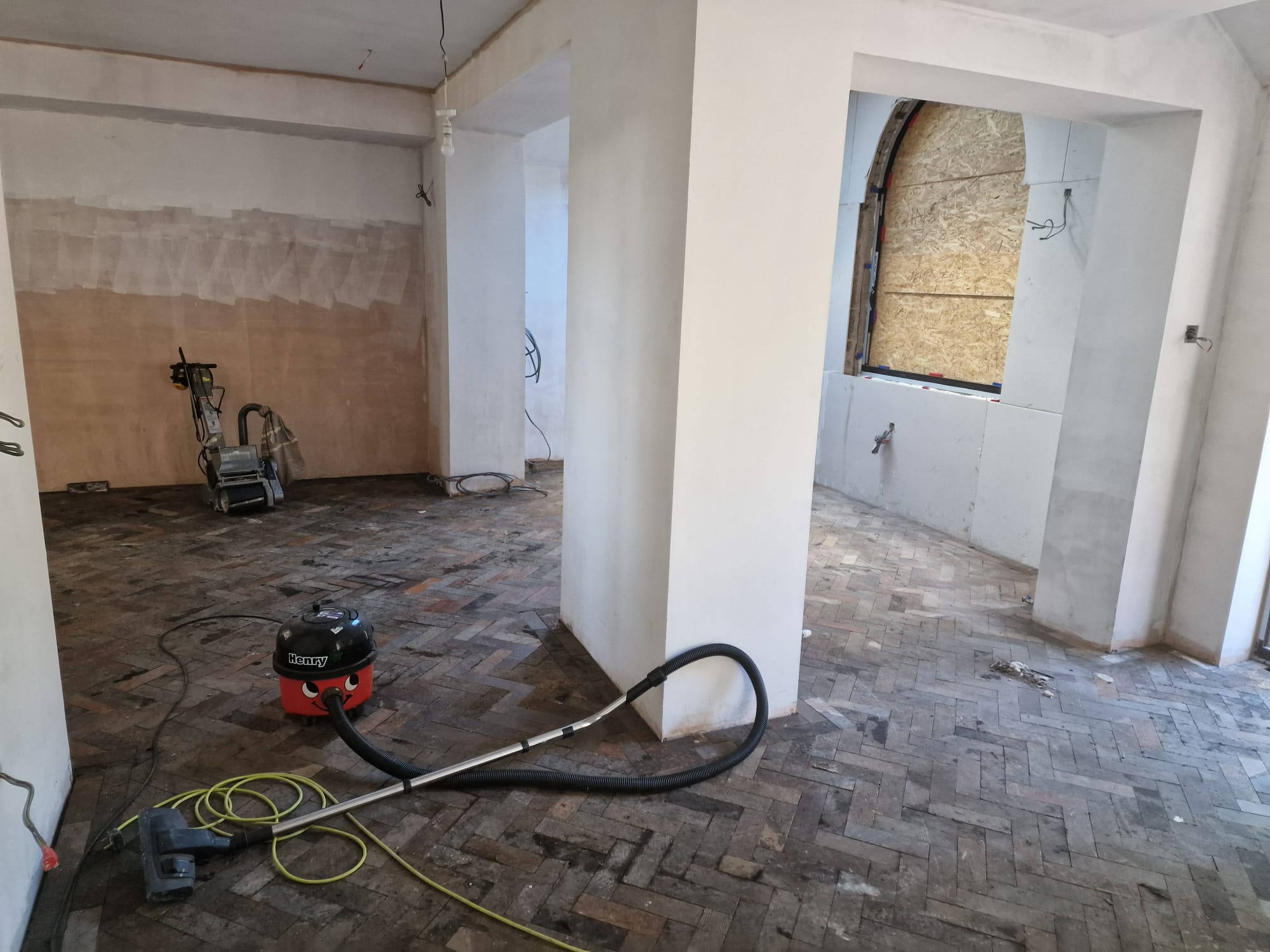 Interior of period property stripped back to bare floors and plaster ready for full renovation