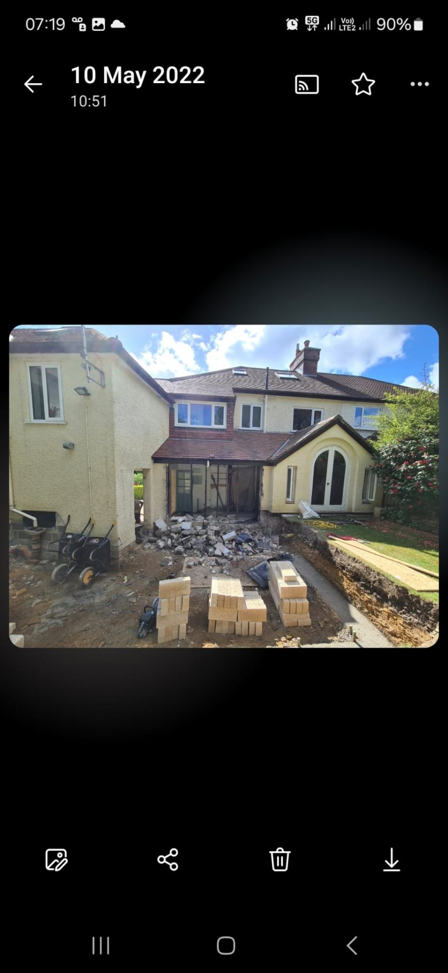 Rear single-storey house extension during construction with new opening into the existing kitchen